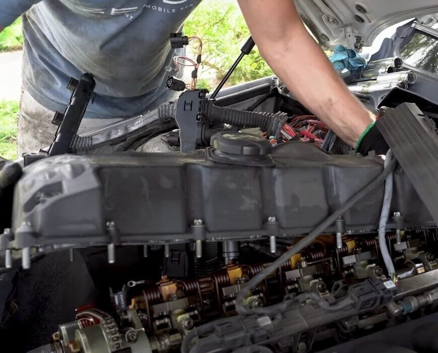 Mobile mechanic engine repairs include replacing BMW valve cover gasket in Santa Ana, CA.